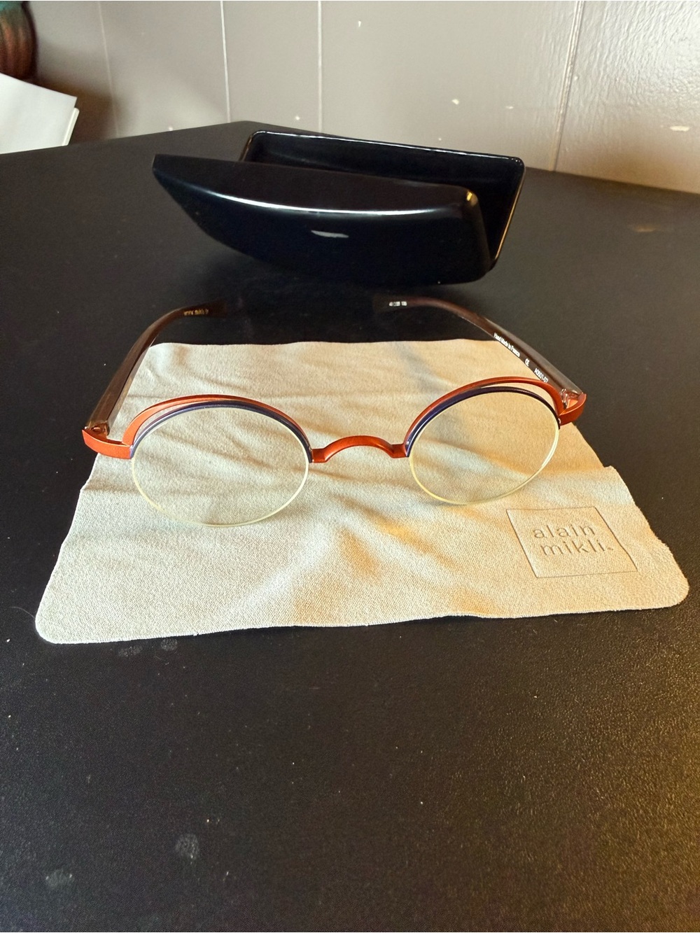 alain mikli Women’s Round Orange and Black Sunglasses